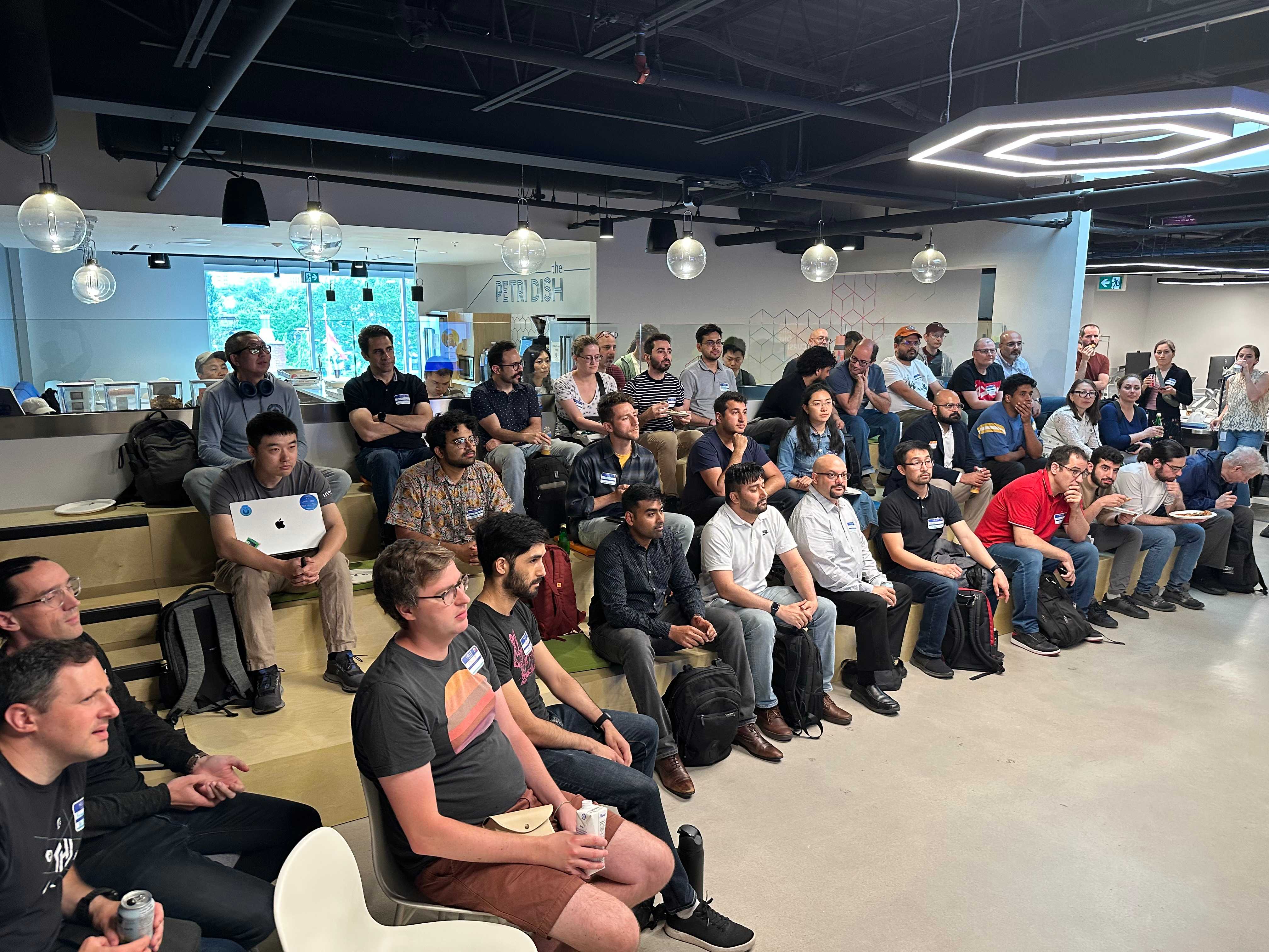 Community members mingling and networking during CNCF Toronto event break